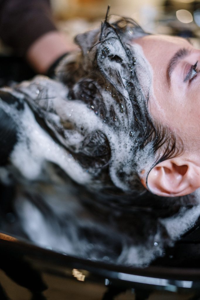 Woman Getting Her Hair Shampoo