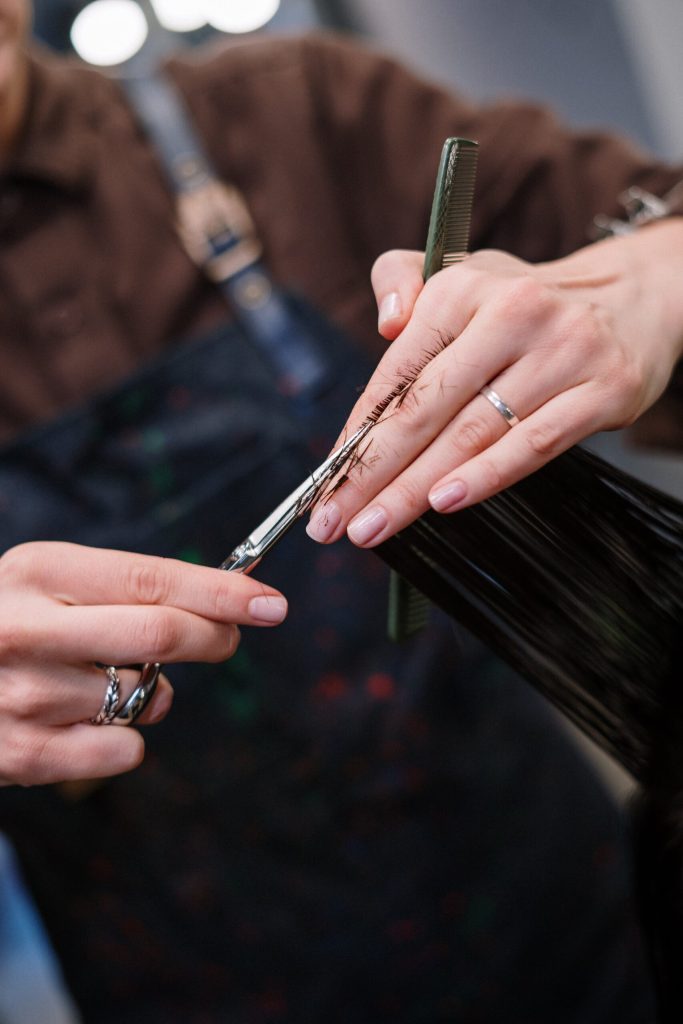 Person Holding Silver and Black Pen